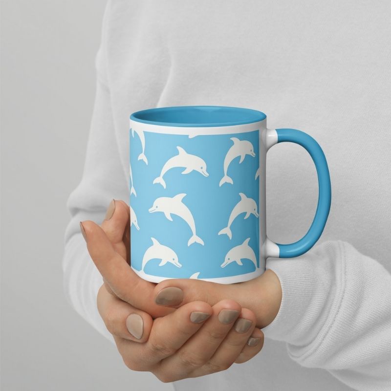 lady's hands are holding the beach coffee mug