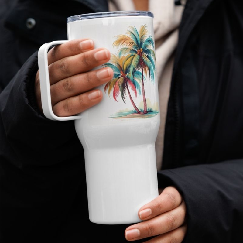 Woman holding our best coffee tumbler in both hands, showing the handle and sleek design of this stylish travel mug and insulated cup.