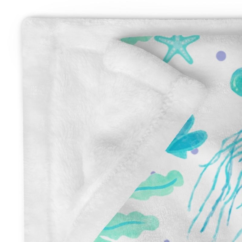 Aqua and lavender jellyfish throw blanket with white reverse side folded corner — 50x60 coastal throw