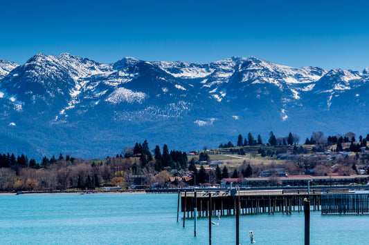 Piers at the edge of Flathead Lake with Mountains in the Background