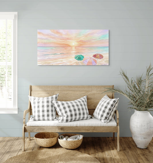 Pastel Sunset Coastal Canvas Art hanging on a wall above a wooden bench