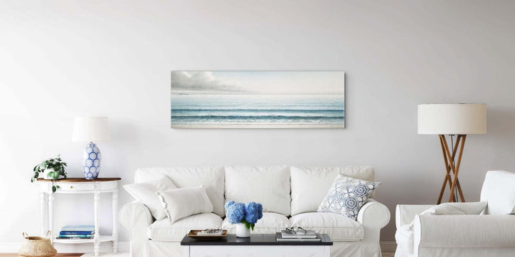 Living room wall art canvas hanging above a white sofa