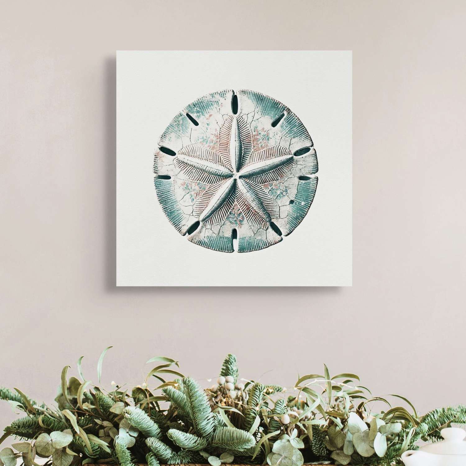 Sand dollar wall art canvas hanging in a living room