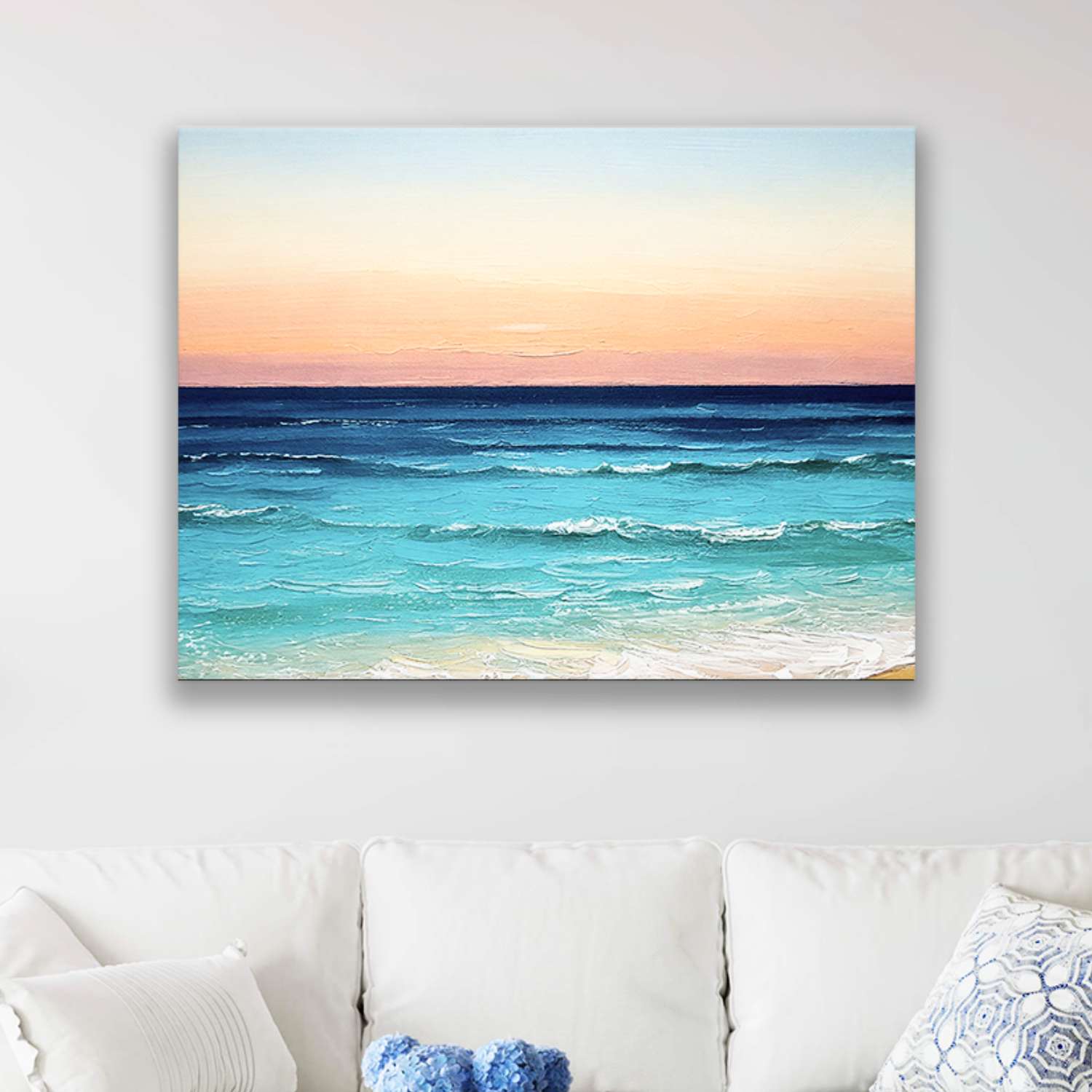 Tropical sunset wall art canvas hanging in a living room