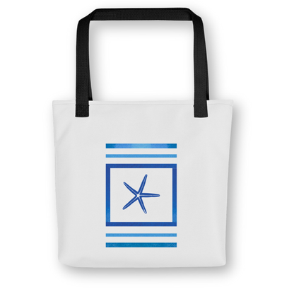 Front view of navy blue tote bag with central starfish framed by bold ocean-blue stripes, black handles, and a coastal-inspired design.
