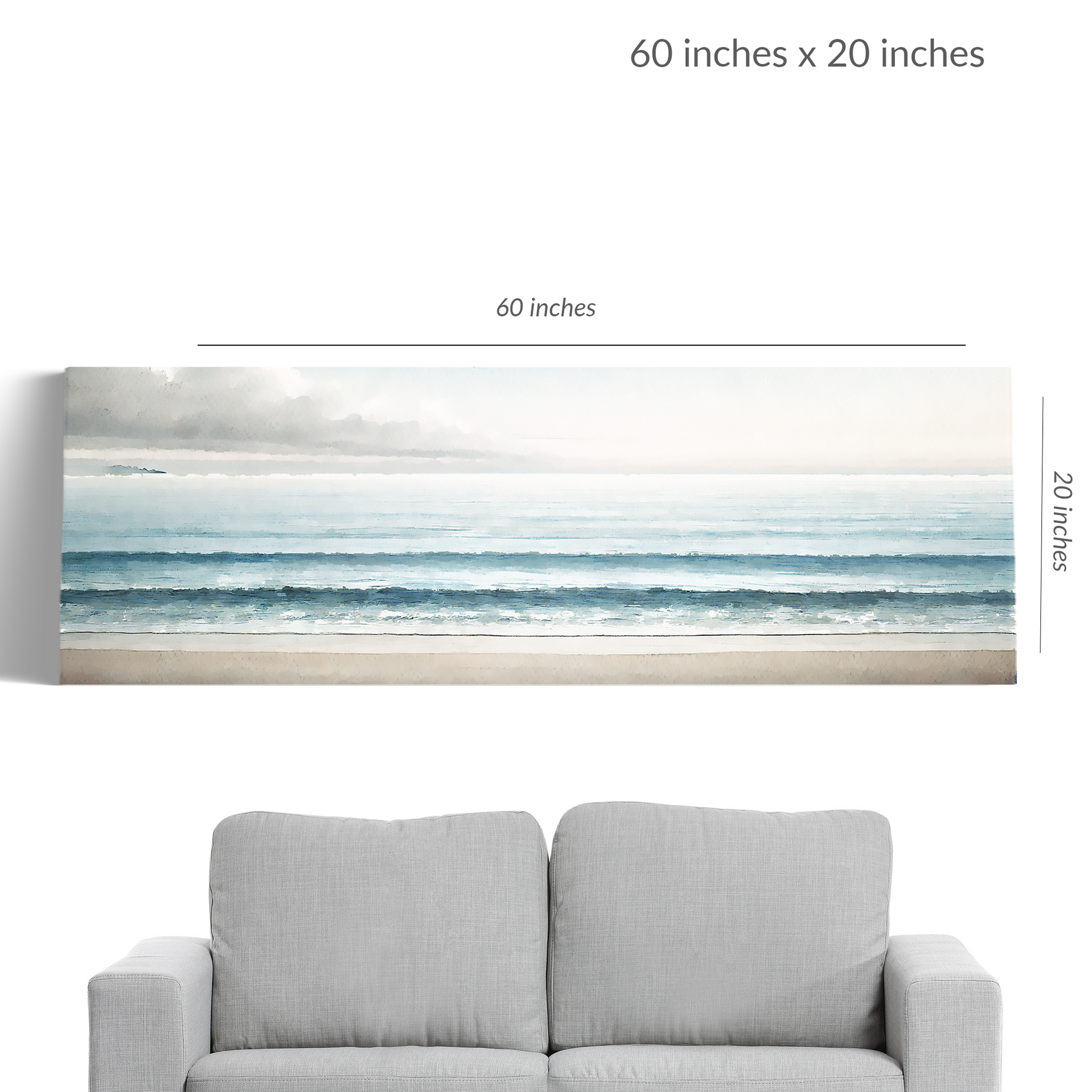 A couch under beach canvas art BEYOND THE BLUE. Gallery wrap canvas in landscape orientation. Text reads: “60 inches x 20 inches”
