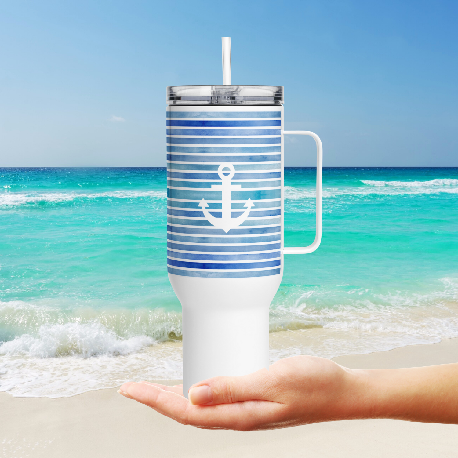 Coastal 40 oz tumbler with anchor design shown at the ocean, the best coastal coffee tumbler for beach lovers.