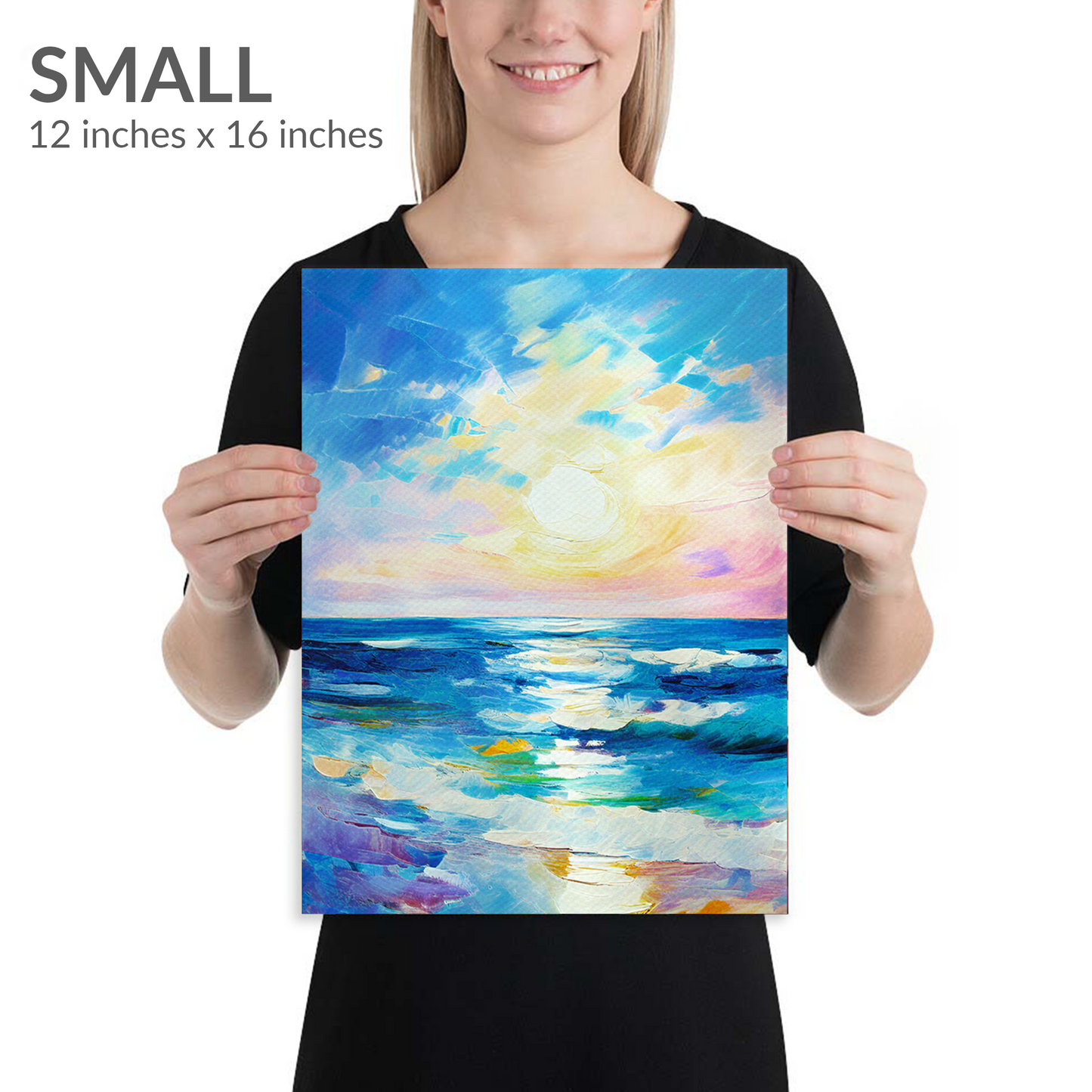 A woman holds the small size of beach wall art REWARD. Gallery wrap canvas in portrait orientation. Text reads: “SMALL 12 inches x 16 inches”