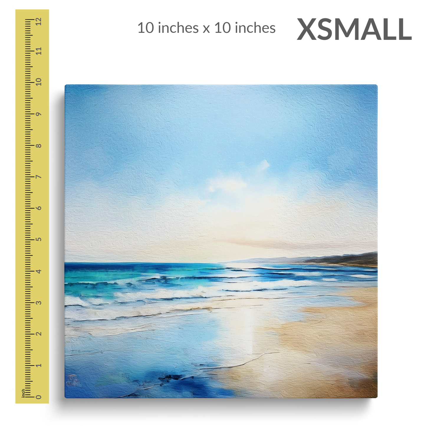 A 12 inch ruler is next to the extra small size of beach canvas wall art SALTY BREEZE. Gallery wrap canvas is square. Text reads: “X-SMALL 10 inches x 10 inches”