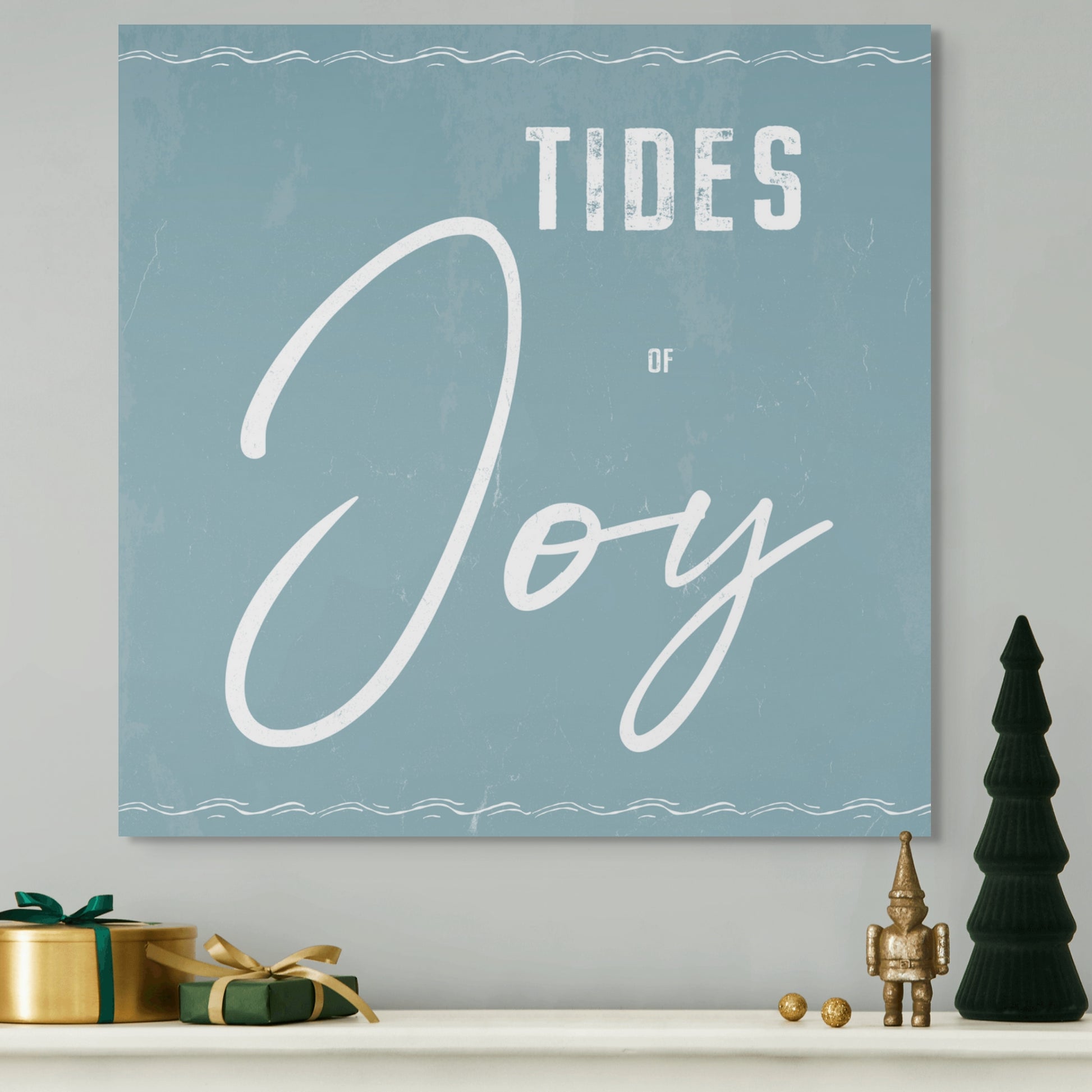 Christmas Canvas TIDES OF JOY. The piece hangs on a wall.
