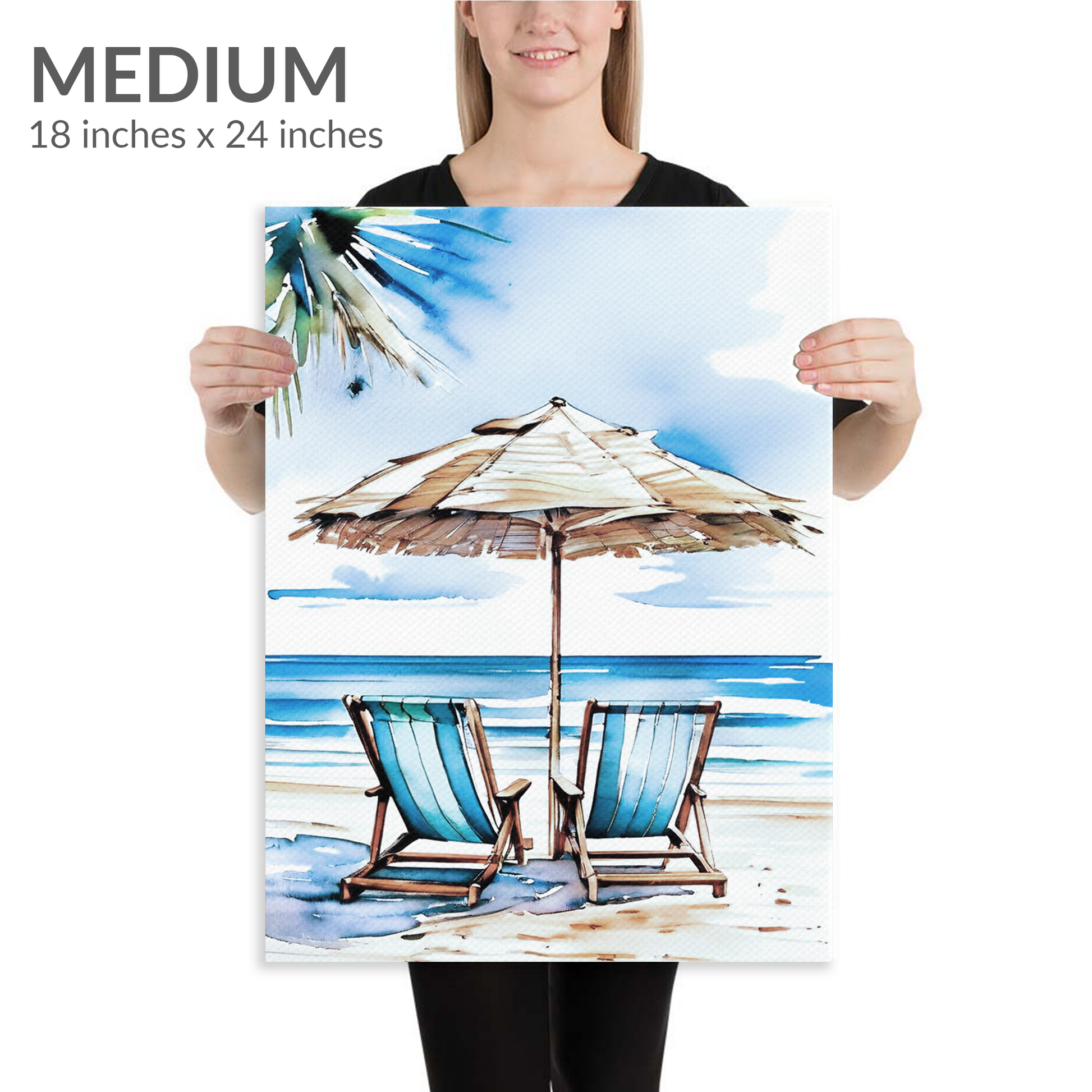 A woman holds the medium size of beach canvas art ESCAPE. The coastal canvas art is in portrait orientation. Text reads: “Medium 18 inches x 24 inches”