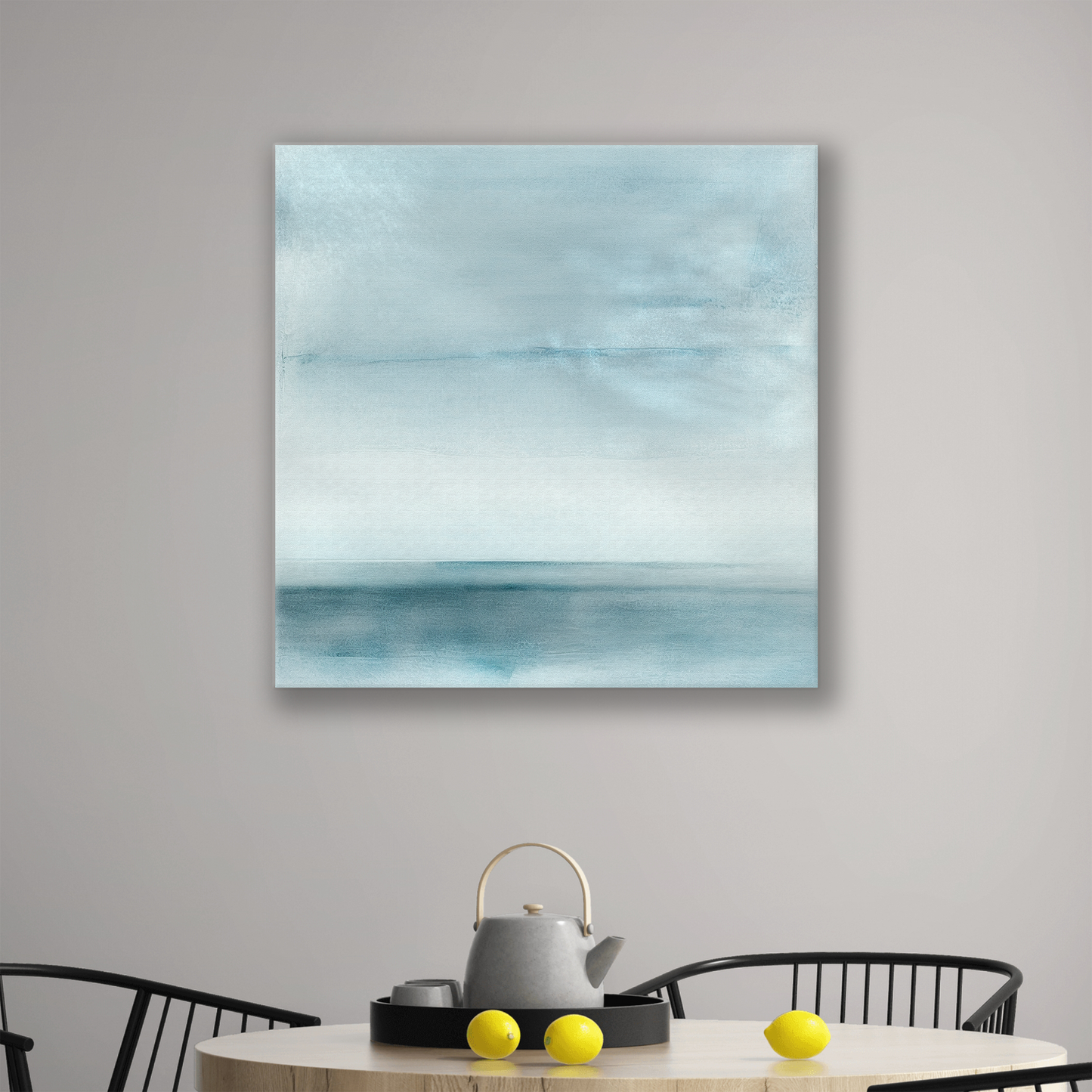 The ocean wall art canvas BLUESCAPE. The piece hangs on a wall.
