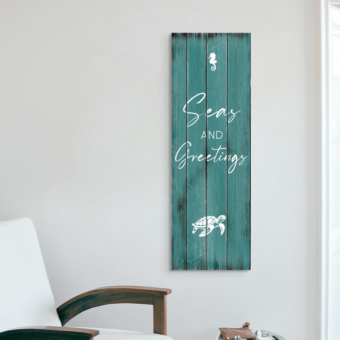 Christmas canvas wall art SEAS AND GREETINGS. The piece hangs on a wall.
