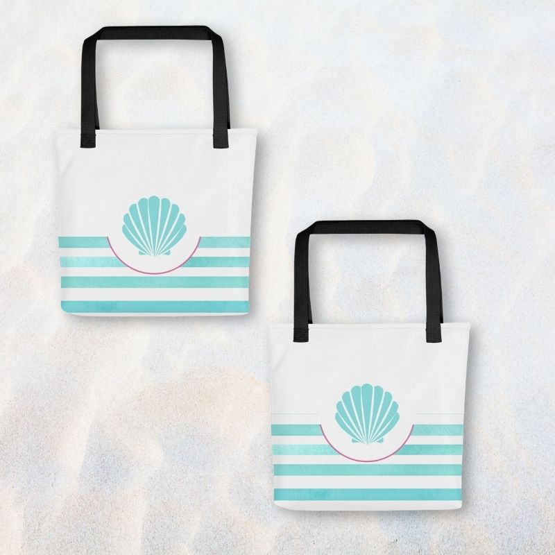 Turquoise tote bag shown front and back on sand, featuring seashell design with aqua stripes and roomy 15” x 15” size.
