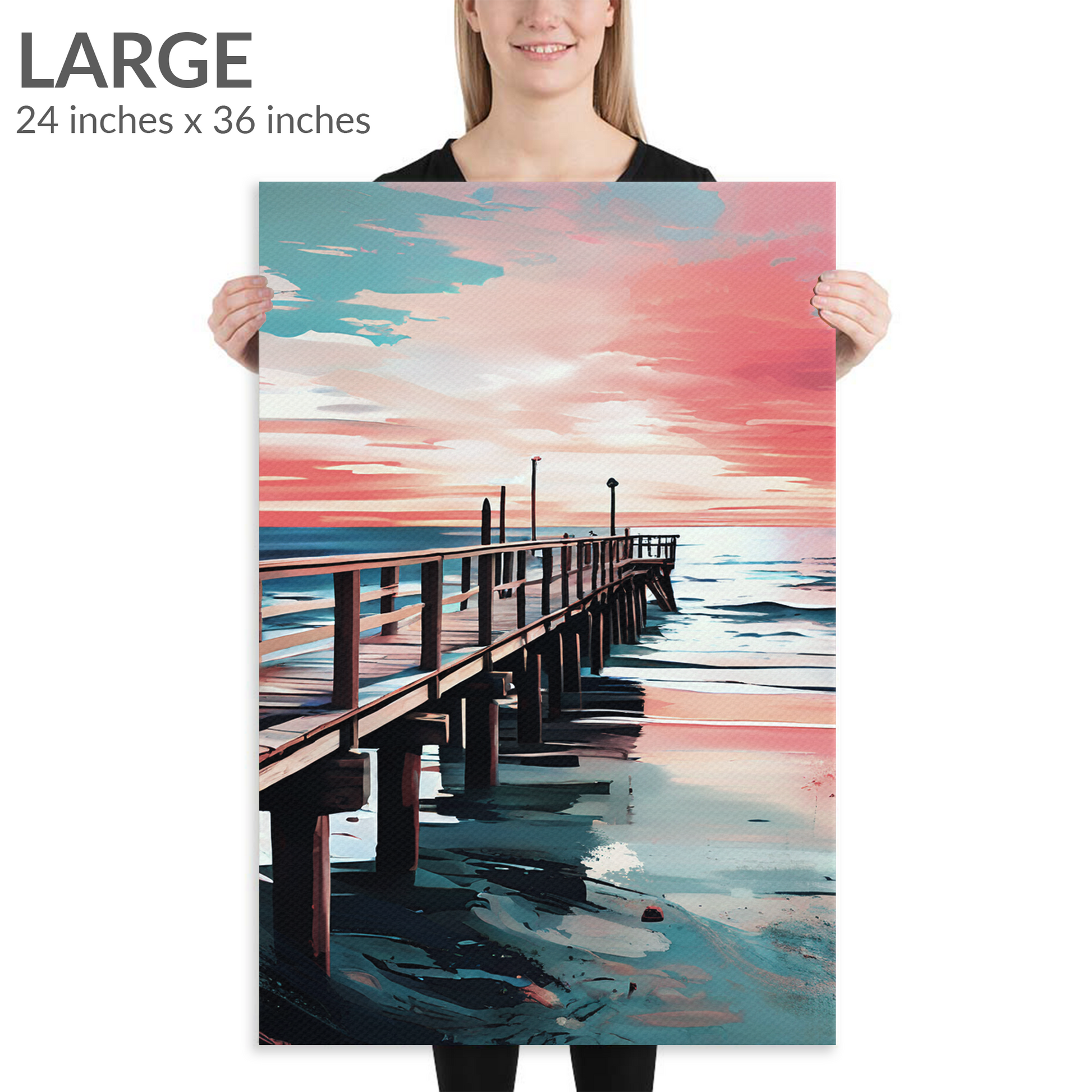 A woman holds the large size of coastal canvas art DISTANCE. The beachside art piece is in portrait orientation. Text reads: “Large 24 inches x 36 inches”