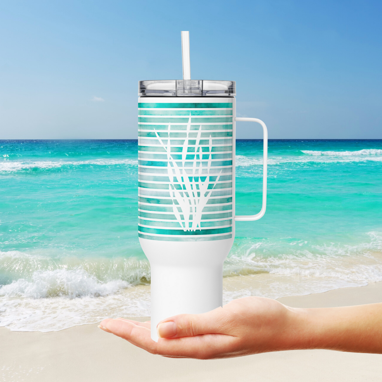 Coastal 40 oz tumbler with sea kelp design shown by the ocean, the best coastal coffee tumbler for ocean lovers.
