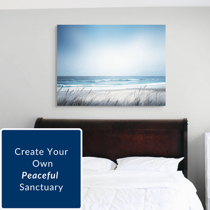 Beach scene painting, Saltwater Surf, above a bed with 'Create Your Own Peaceful Sanctuary' text.