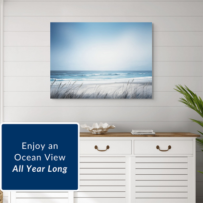 Beach scene painting, salt water surf, on a wall above a white cabinet with decorative items.