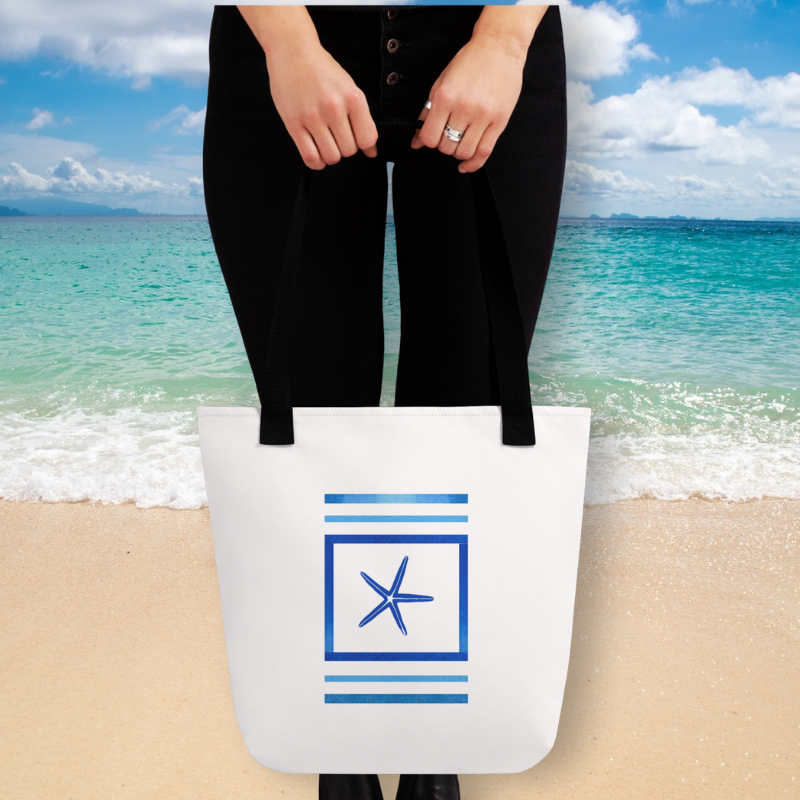 women holding beach tote handbag in front of a beach beach scene
