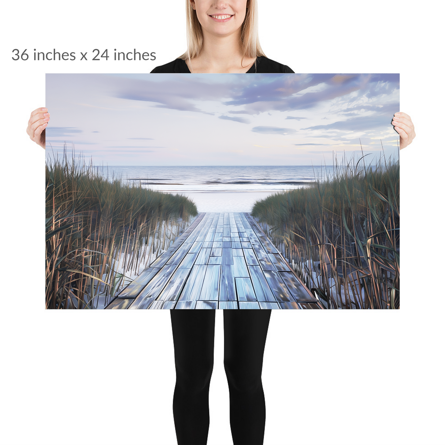 A woman holds the piece. autumn beach wall art BOARDWALK TO SHORE. Unframed Print is in landscape orientation. Text reads: 36 in x 24 in
