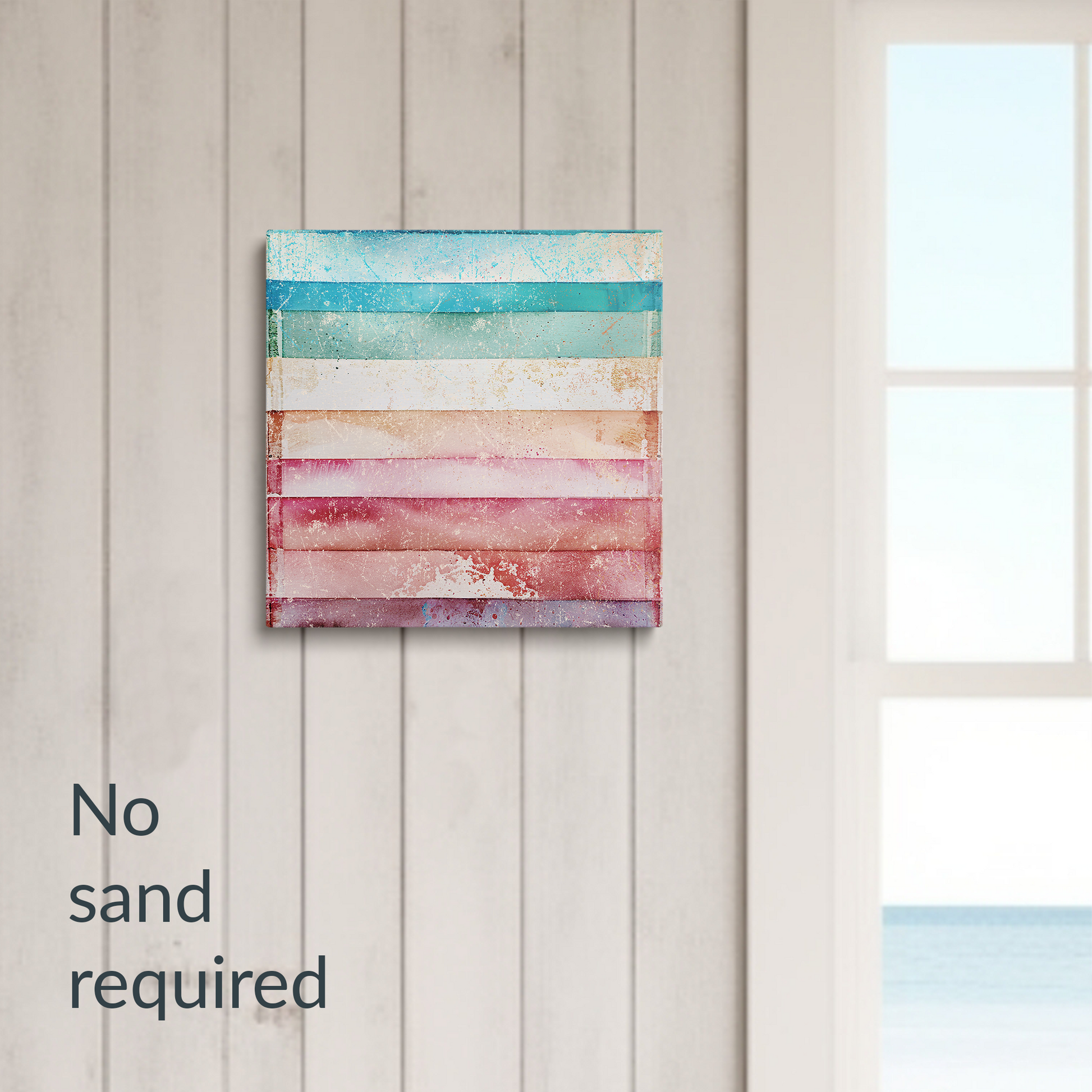 beach wall art on canvas TROPICAL VIBES hanging on a wall next to a window with beach view. Text reads: “No sand required.”