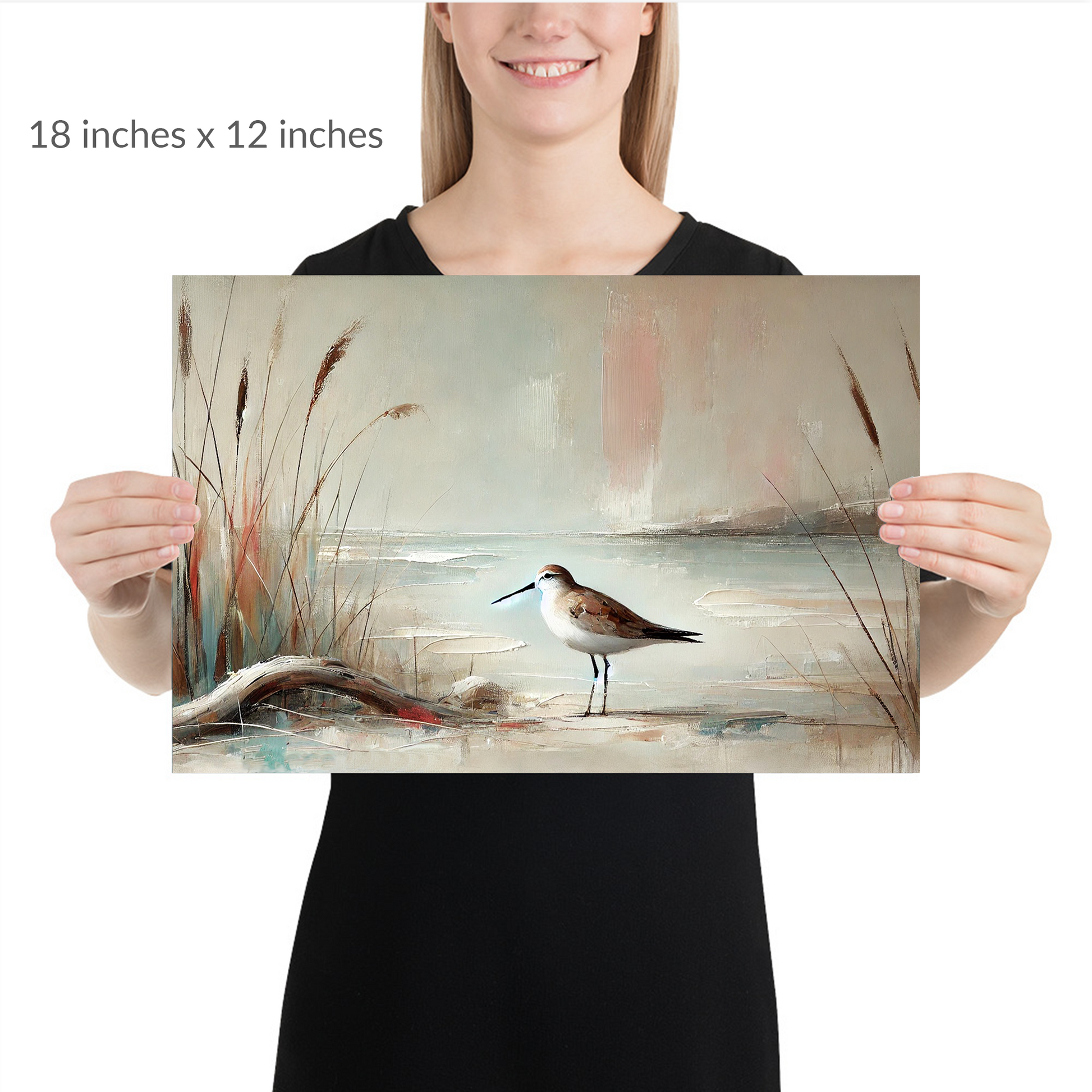 A woman holds the piece. autumn coastal art AUTUMN SANDPIPER. Unframed Print is in landscape orientation. Text reads: 18 in x 12 in