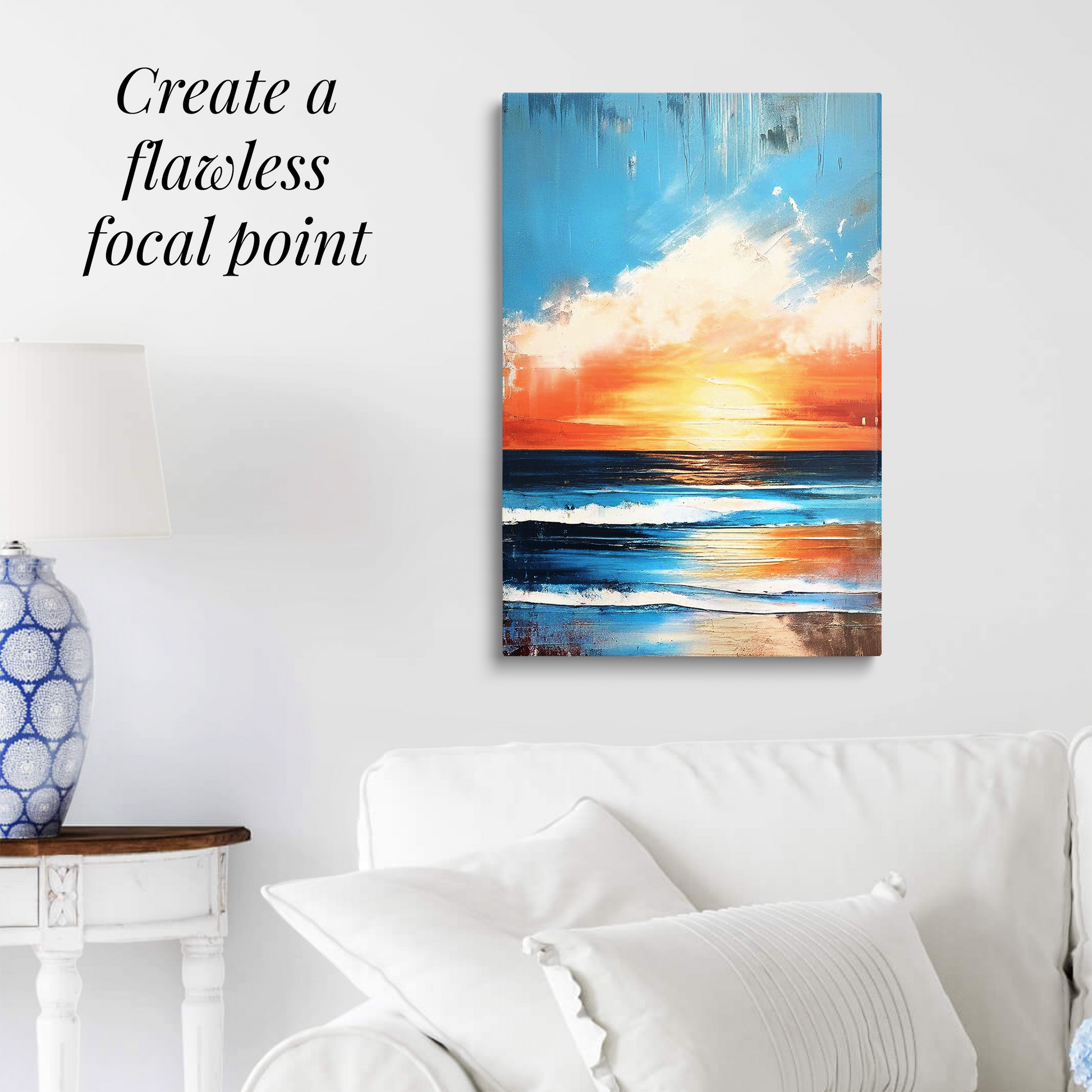 beachside art REFRESH hanging over a white couch. Text reads: “Create a flawless focal point.”