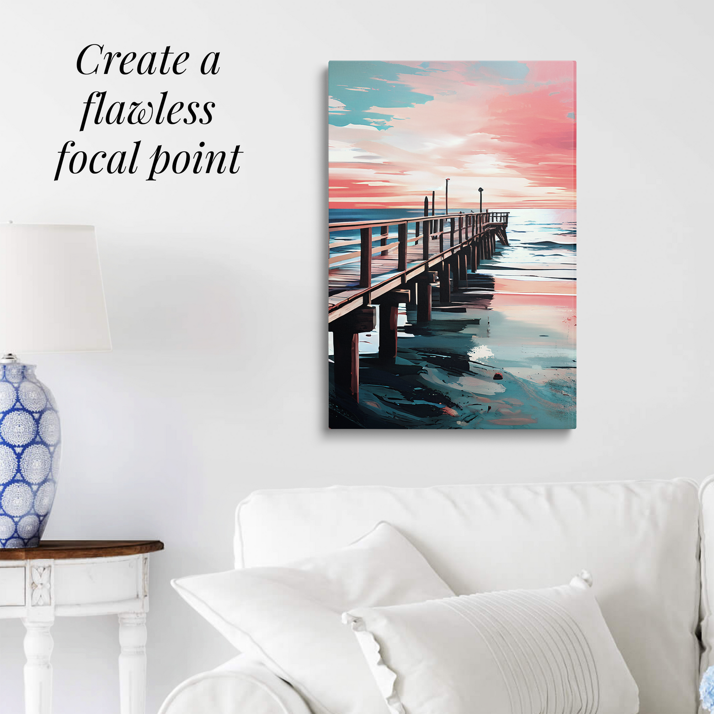 coastal canvas art DISTANCE hanging over a white couch. Text reads: “Create a flawless focal point.”