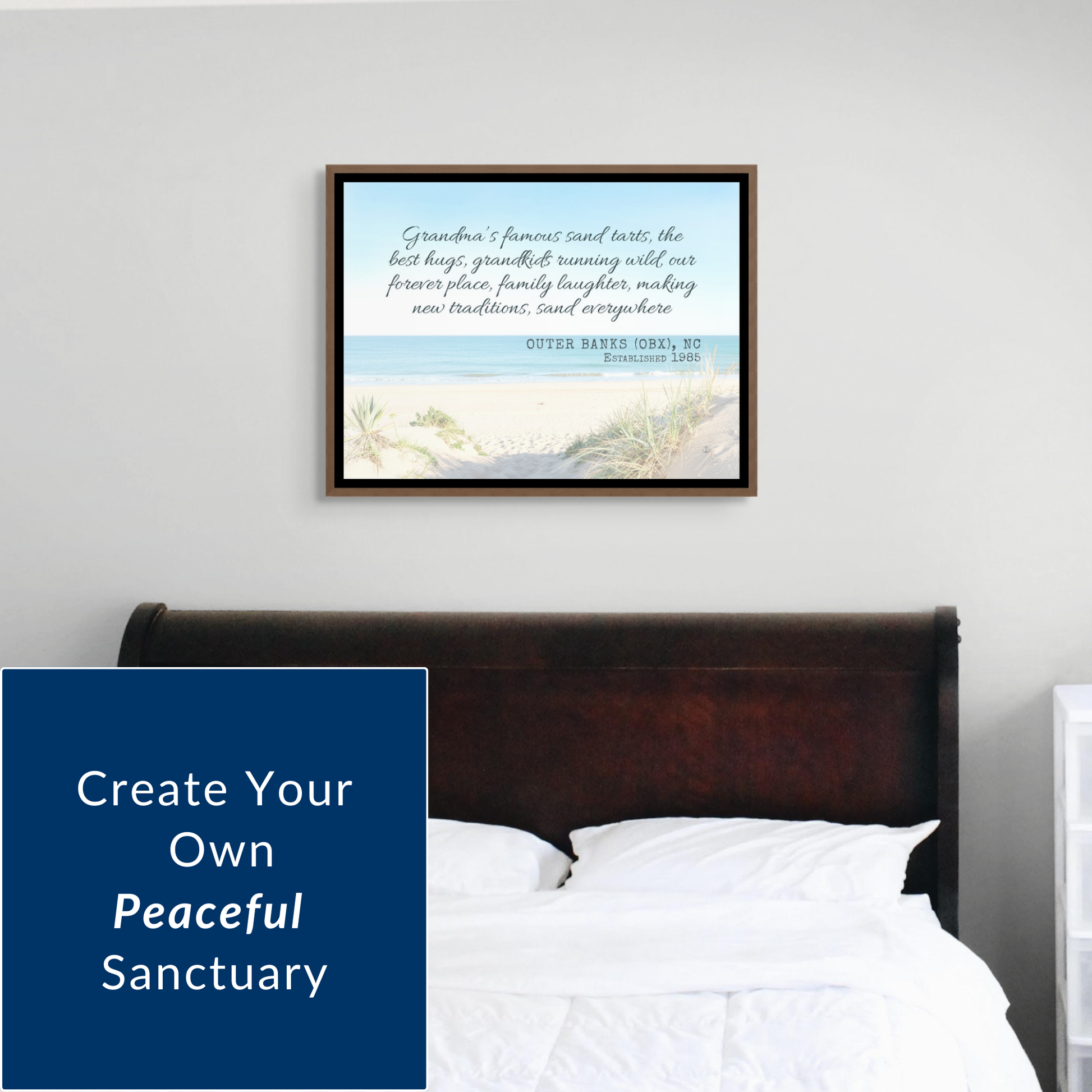 Interior design shot of a bedroom featuring a custom beach memory canvas hanging above a dark wooden bed frame. The artwork brings a calming blue tone to the room. Text overlay on the left reads, "Create Your Own Peaceful Sanctuary”
