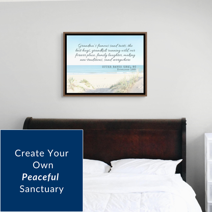 Interior design shot of a bedroom featuring a custom beach memory canvas hanging above a dark wooden bed frame. The artwork brings a calming blue tone to the room. Text overlay on the left reads, "Create Your Own Peaceful Sanctuary”
