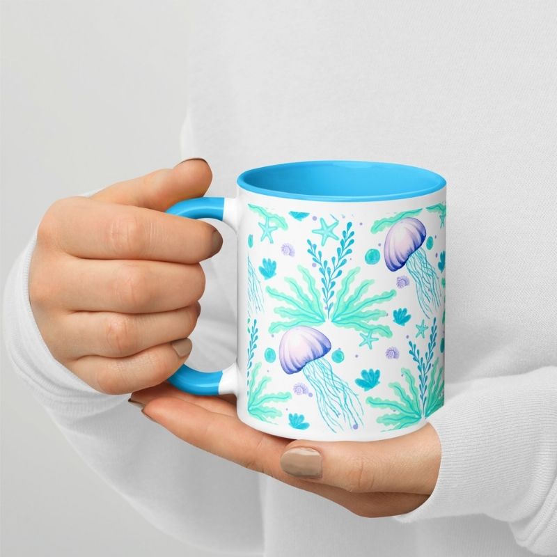 Lady holding ceramic coffee mug in both hands

