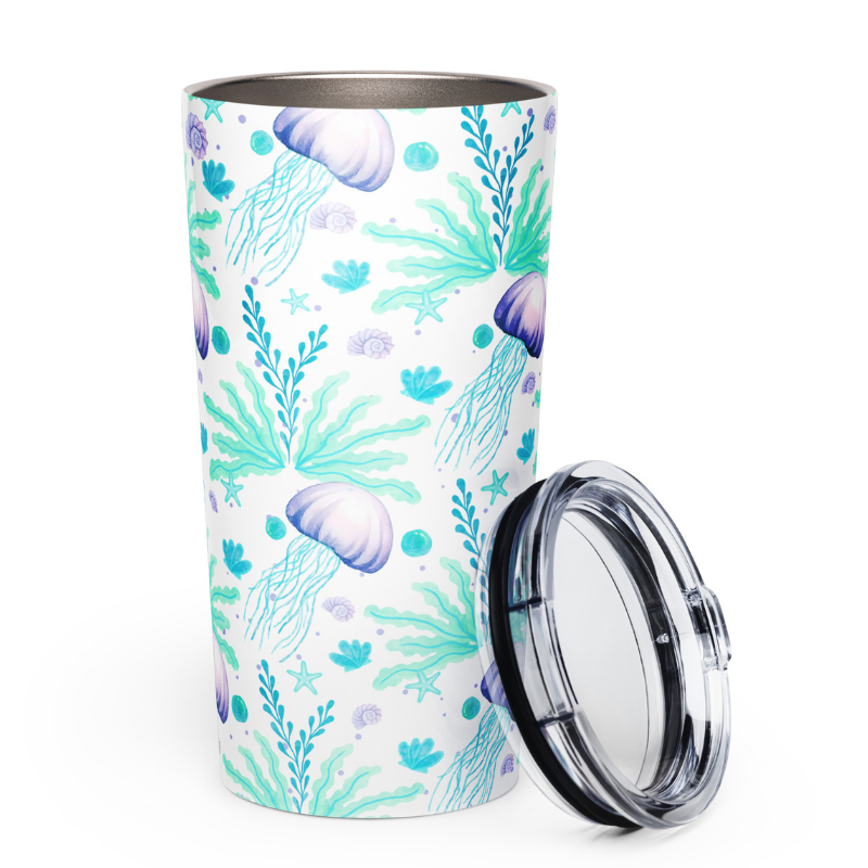 Travel coffee mug insulated with transparent lid propped on the side, jellyfish print visible.
