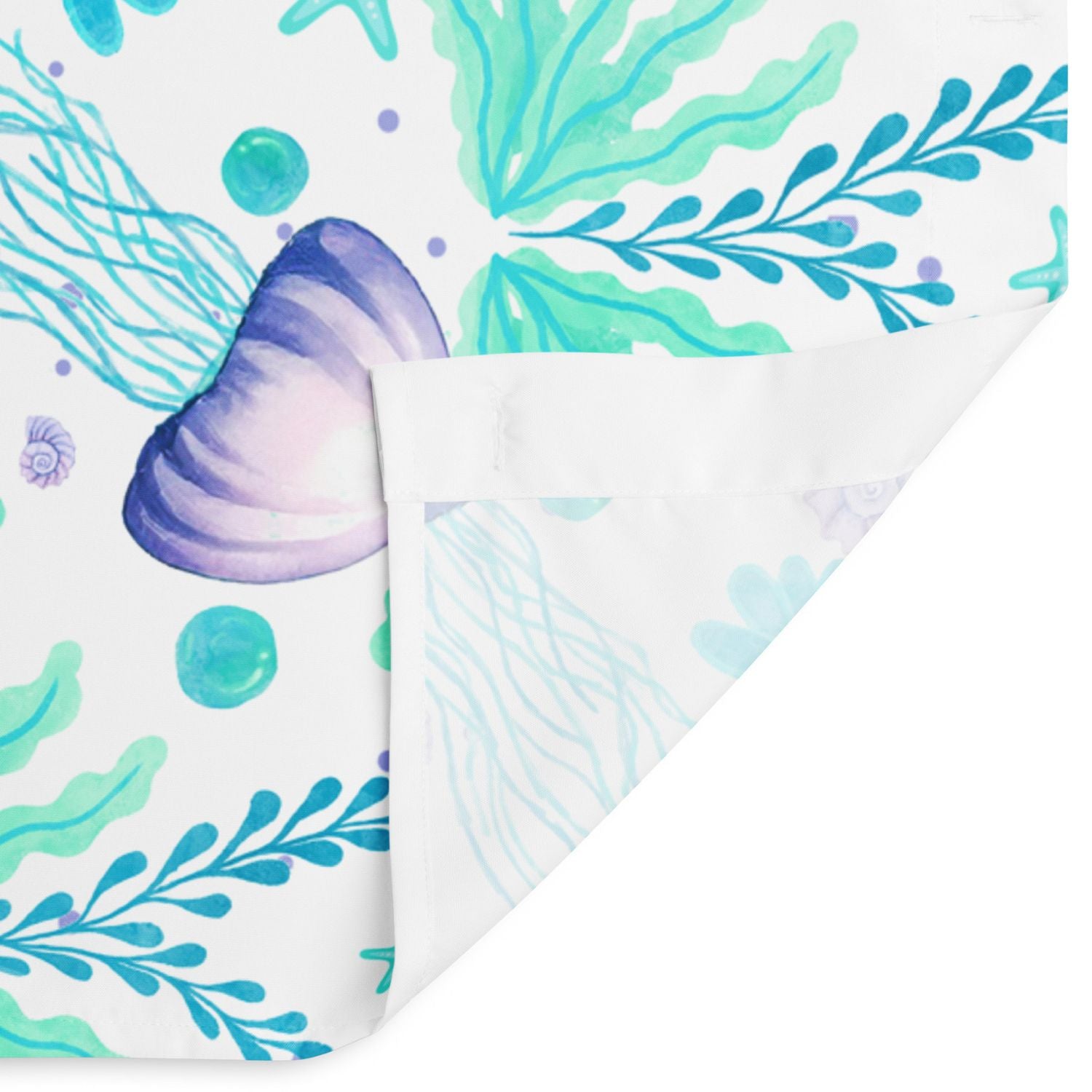 Close-up of jellyfish design — Shower curtain with jellyfish details, a cute coastal pattern showing back hem and front print
