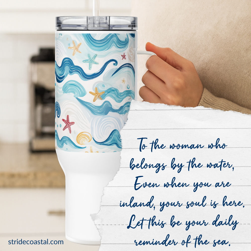 Tumbler with ocean design held by a person, with a quote about being by the water.